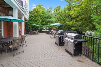 a patio with two bbq grills  at The Reserve at Riverdale, Riverdale, 07457